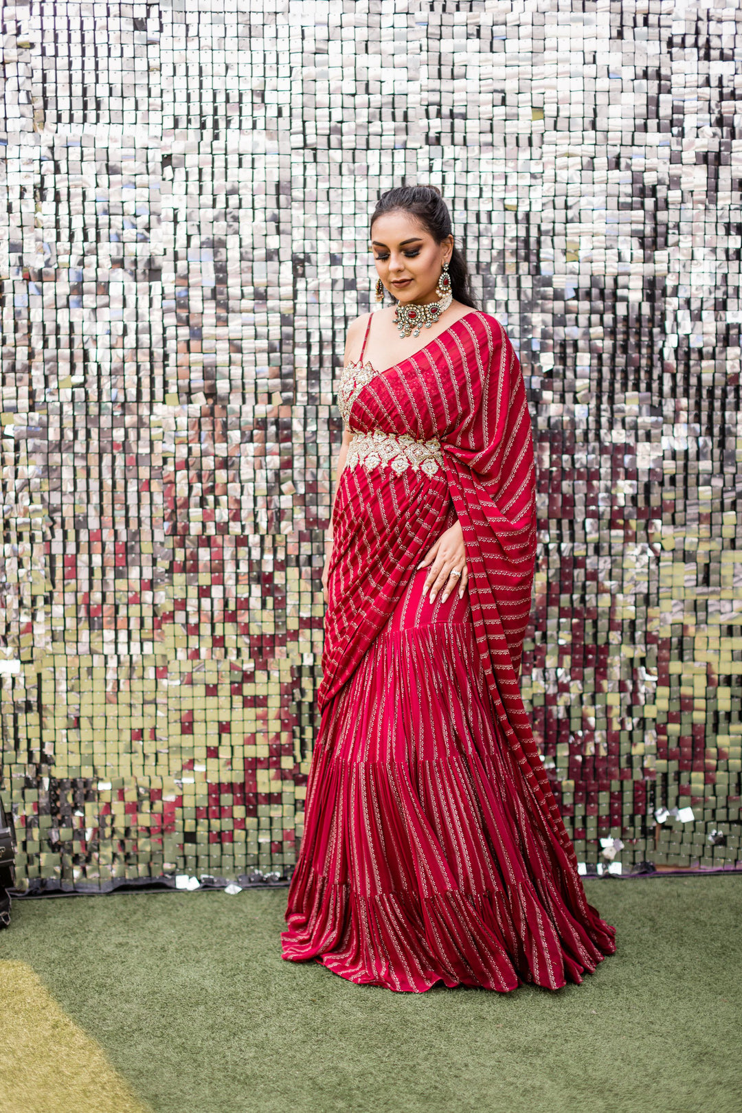 Aanam C in our Red Nurekha Pre-Stitched Saree